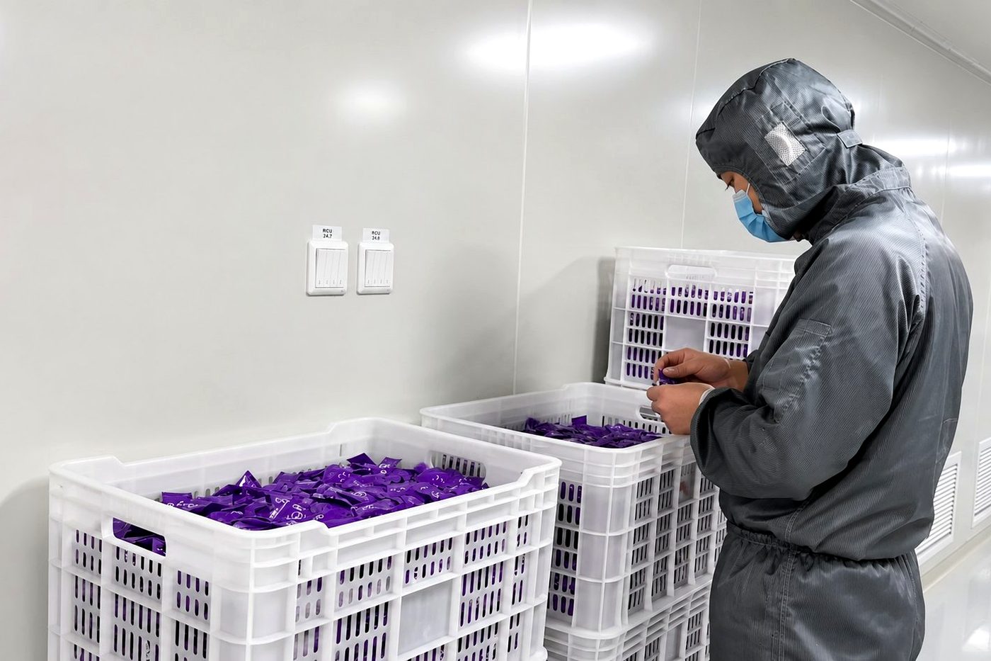Worker inspecting sachets